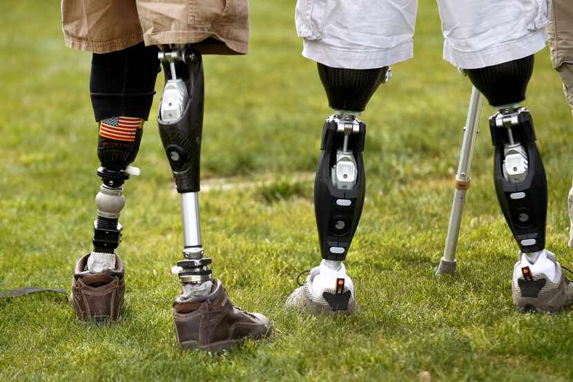 The prosthetic legs of Dana Bowman (left), U.S. Army retired sergeant first class and CEO of...