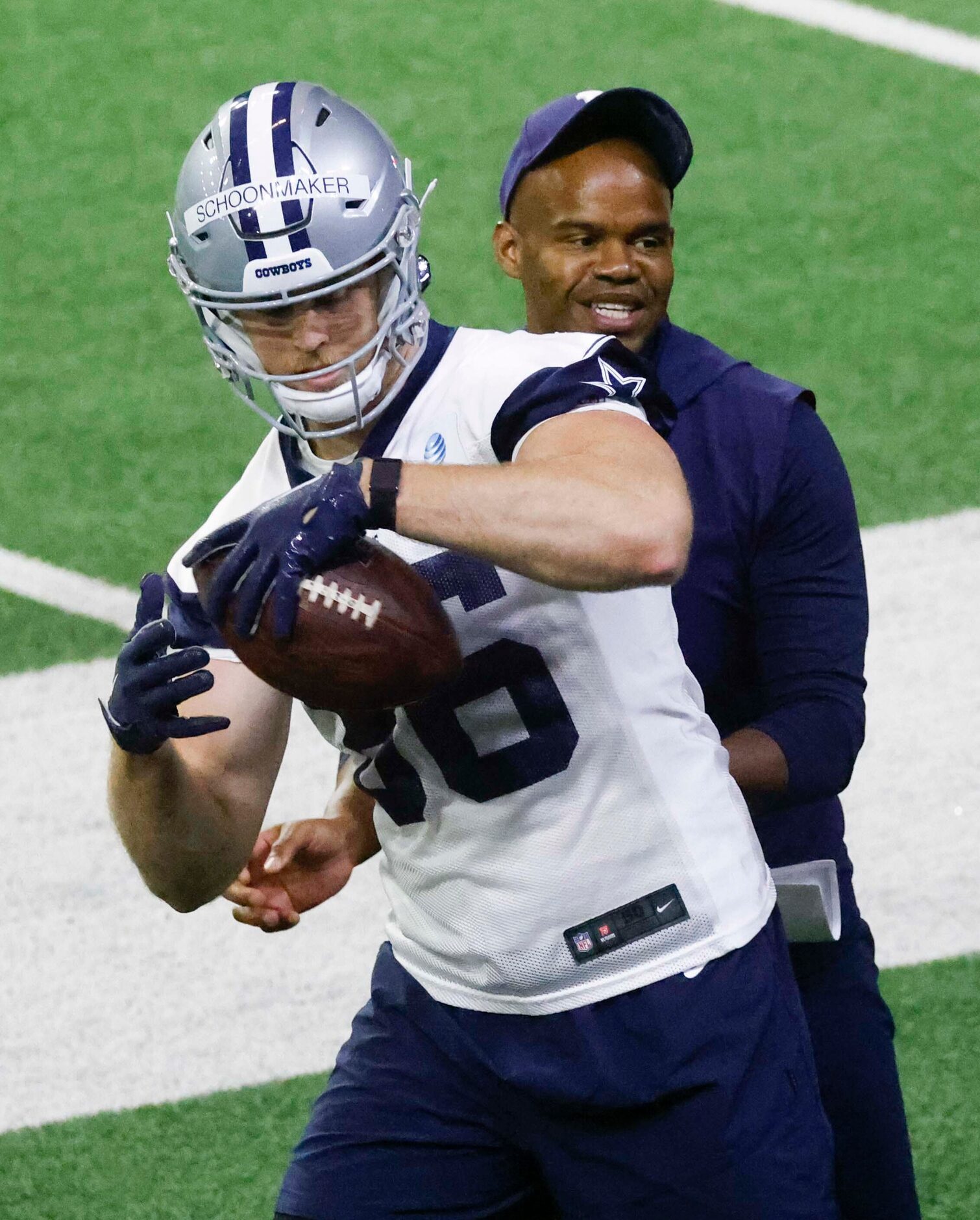 Dallas Cowboys tight end Luke Schoonmaker practices with tight ends coach Lunda Wells during...