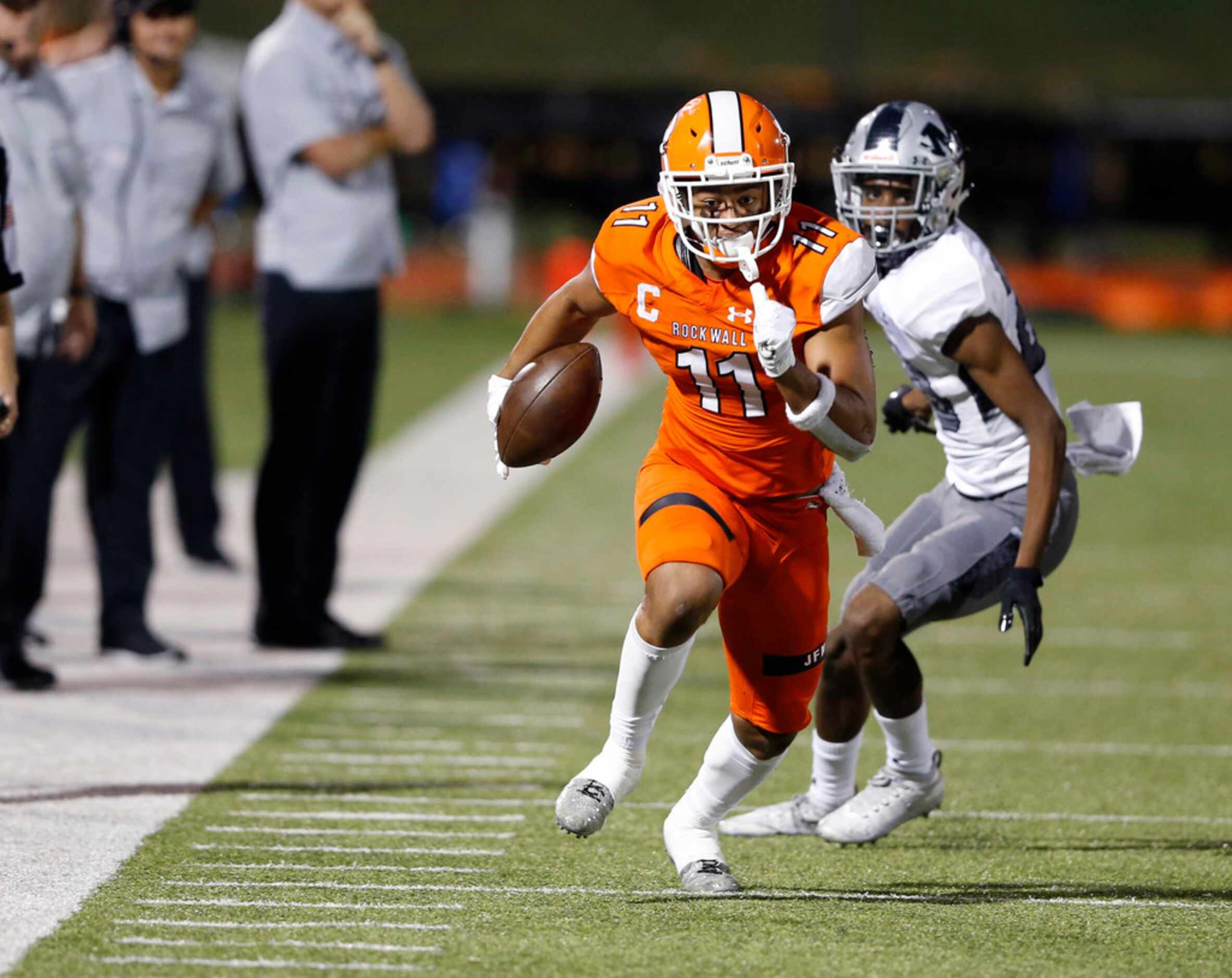 Rockwall's Jaxon Smith-Njigba (11) runs up the field after the catch in a game against...