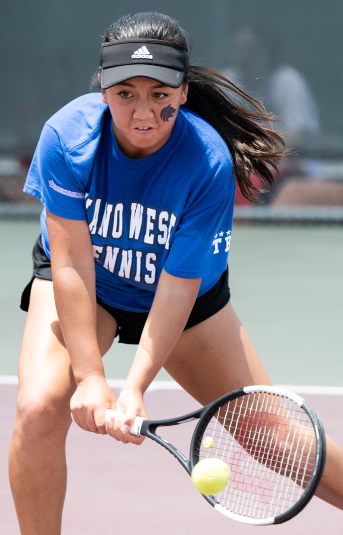 Plano West's Emma Gener returns the ball in a doubles match with teammate Caden Moortgat in...