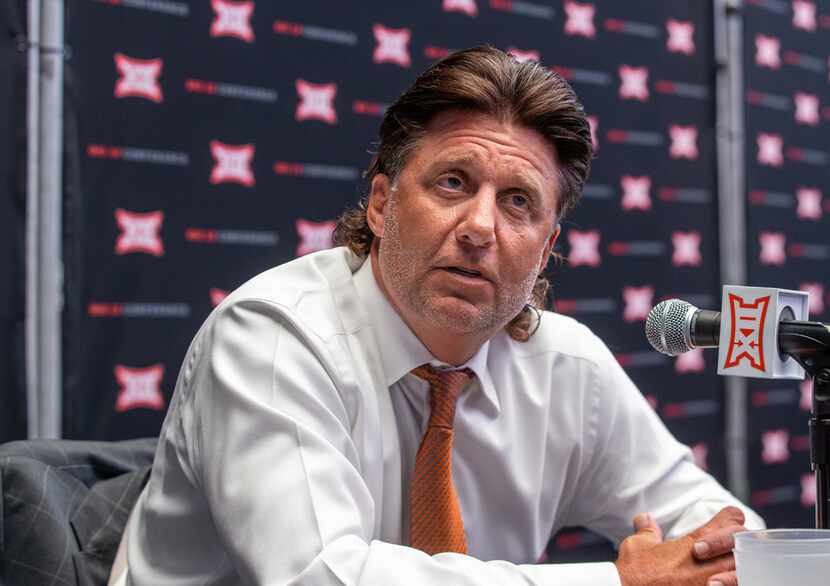 Oklahoma State University head football coach Mike Gundy speaks with reporters during the...