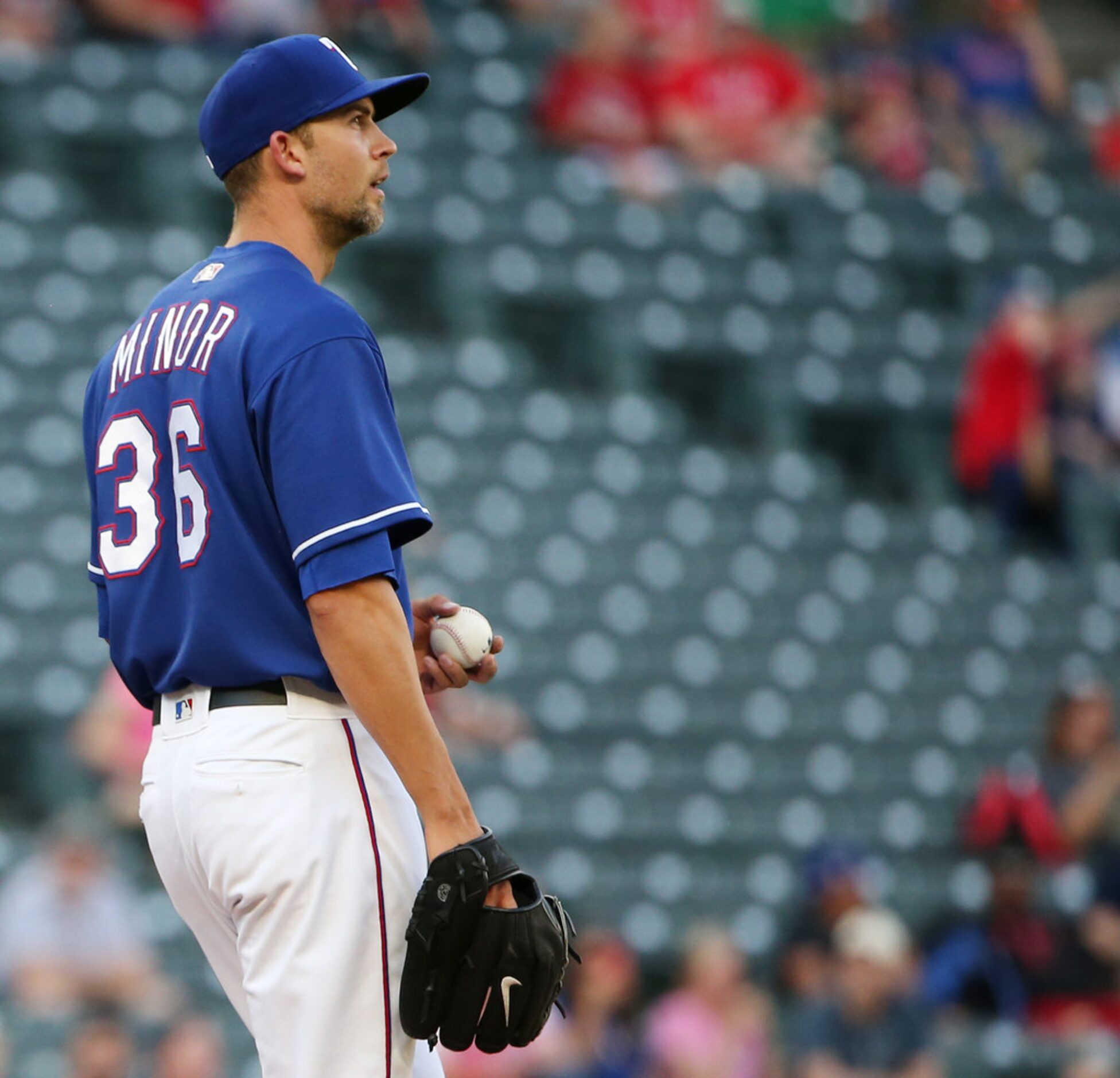 Texas Rangers starting pitcher Mike Minor (36) reacts to a two-run home run hit by Detroit...