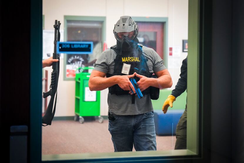 A school marshal participated in a school safety active shooter training demonstration...