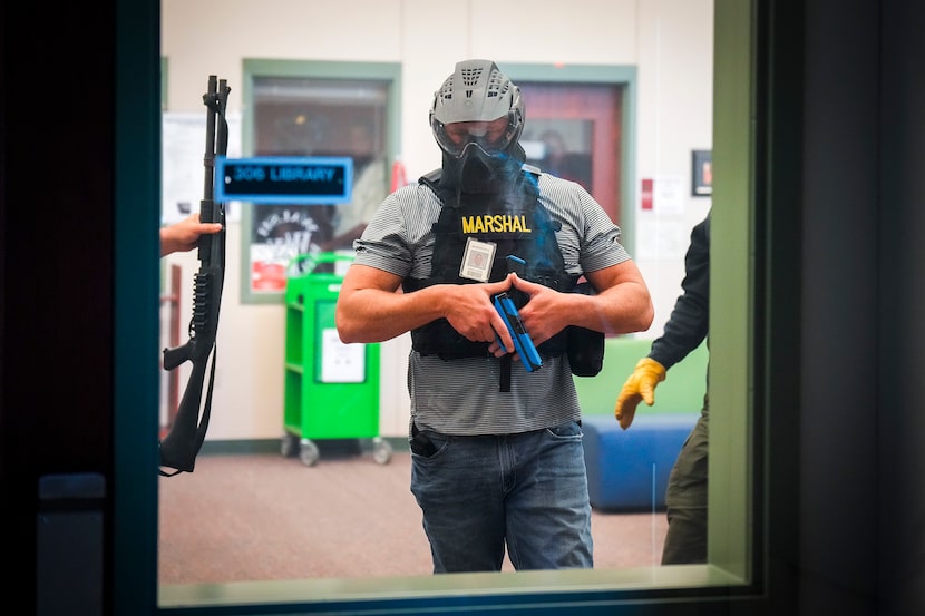 A Texas school marshal participates in an active-shooter training demonstration conducted at...