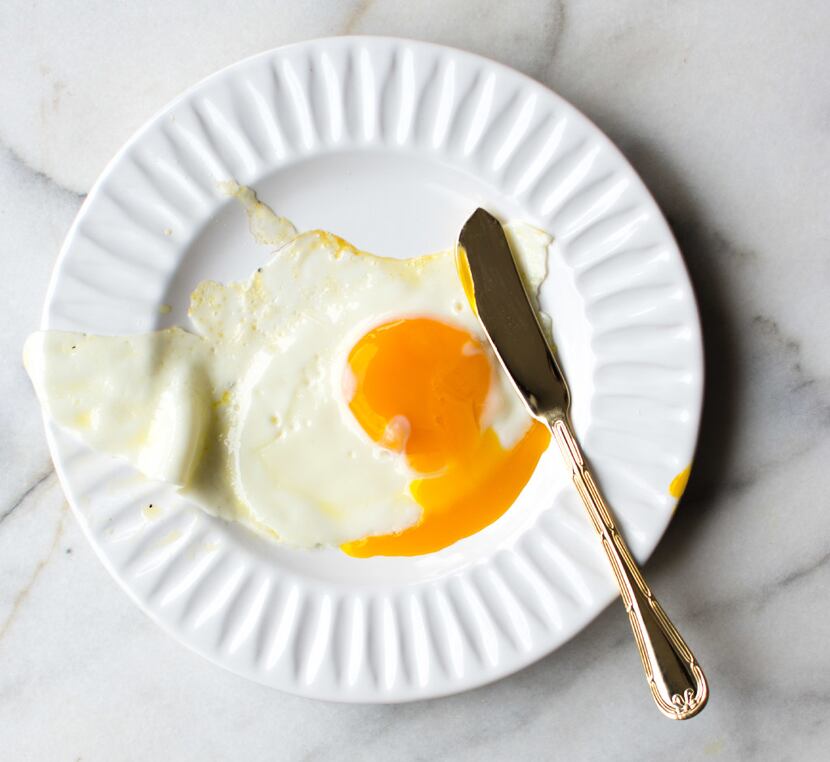 Cook until the whites are cooked and the clear coating that covers the yolk is almost gone.