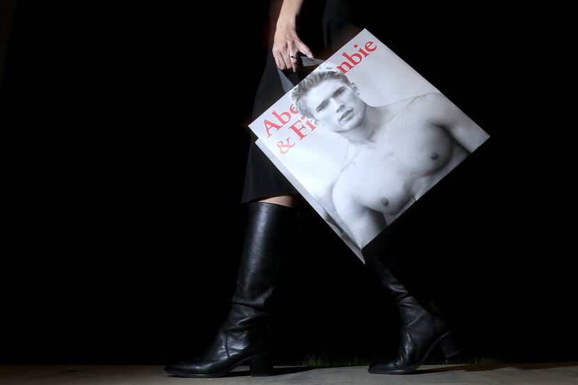 FILE - In this Nov. 14, 2011, file photo, a shopper carries her Abercrombie & Fitch...
