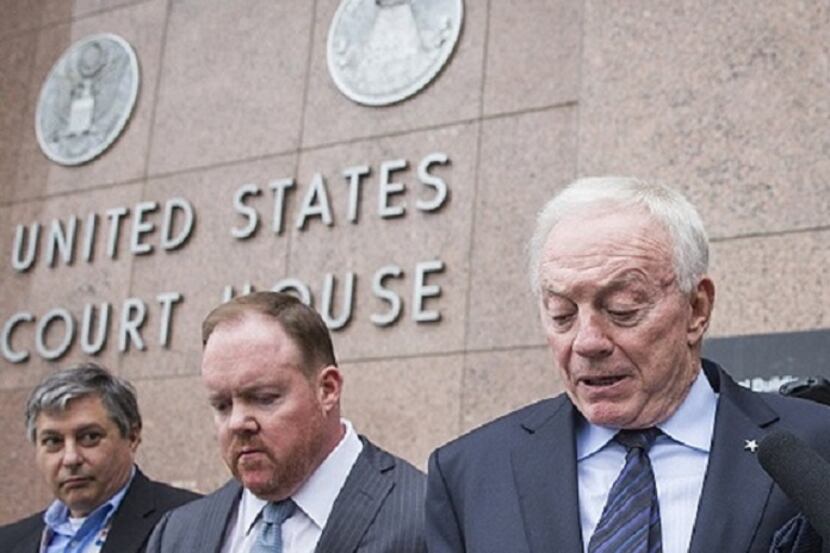 Levi McCathern (middle) with Dallas Cowboys owner Jerry Jones (on right) in front of the...