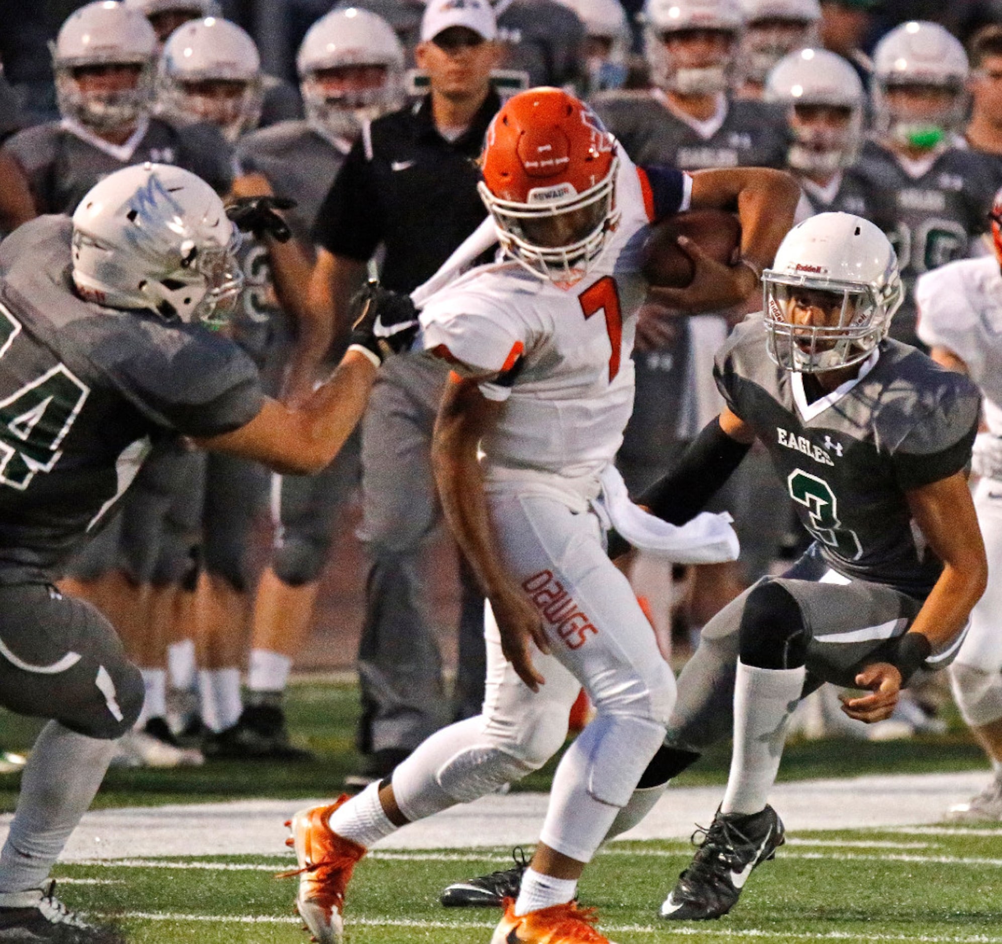 Prosper High School linebacker John Brannon (44) makes a jersey tackle on McKinney North...