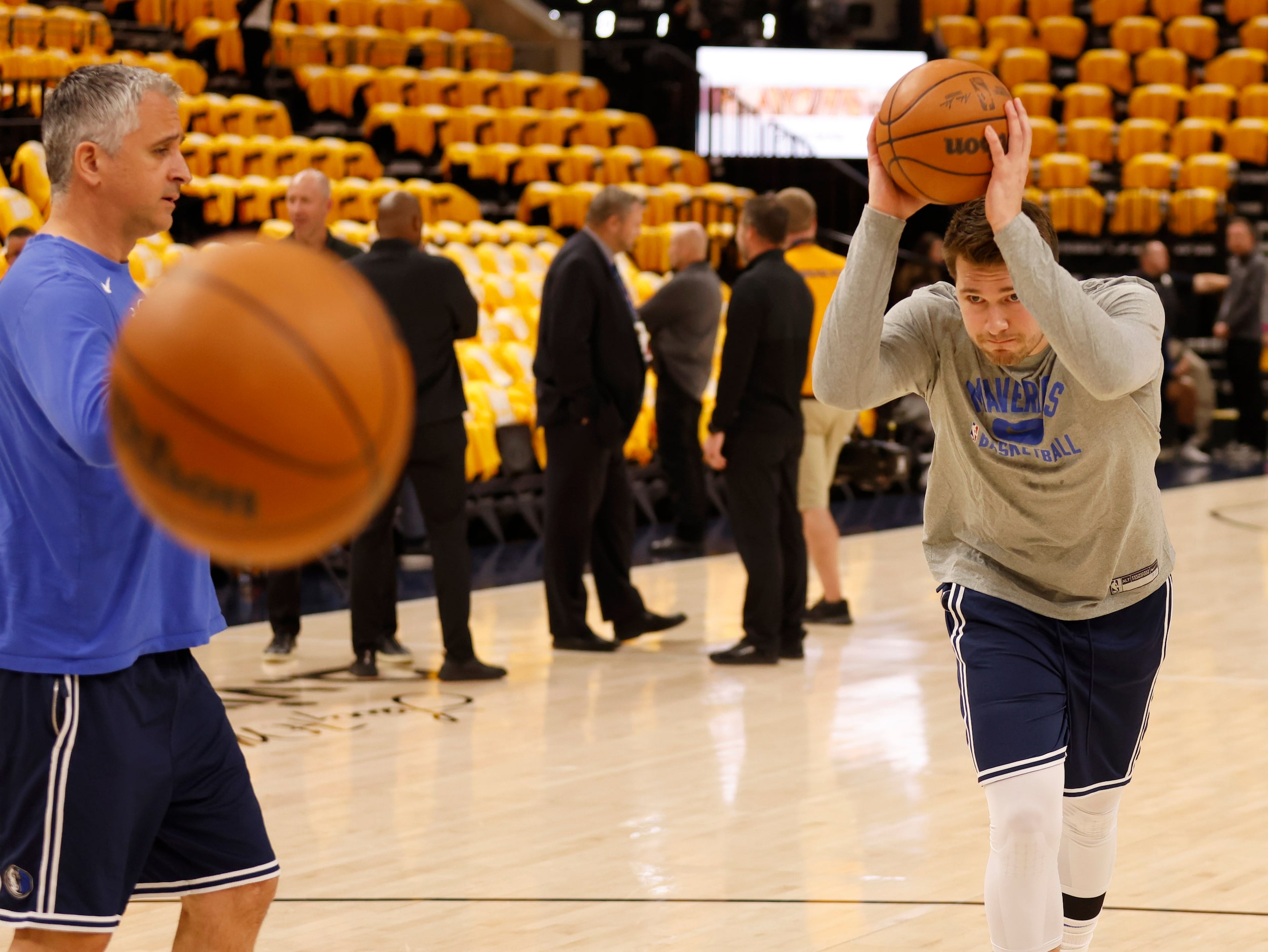 Dallas Mavericks guard Luka Doncic (77) prepares to bounce pass the ball to himself during...