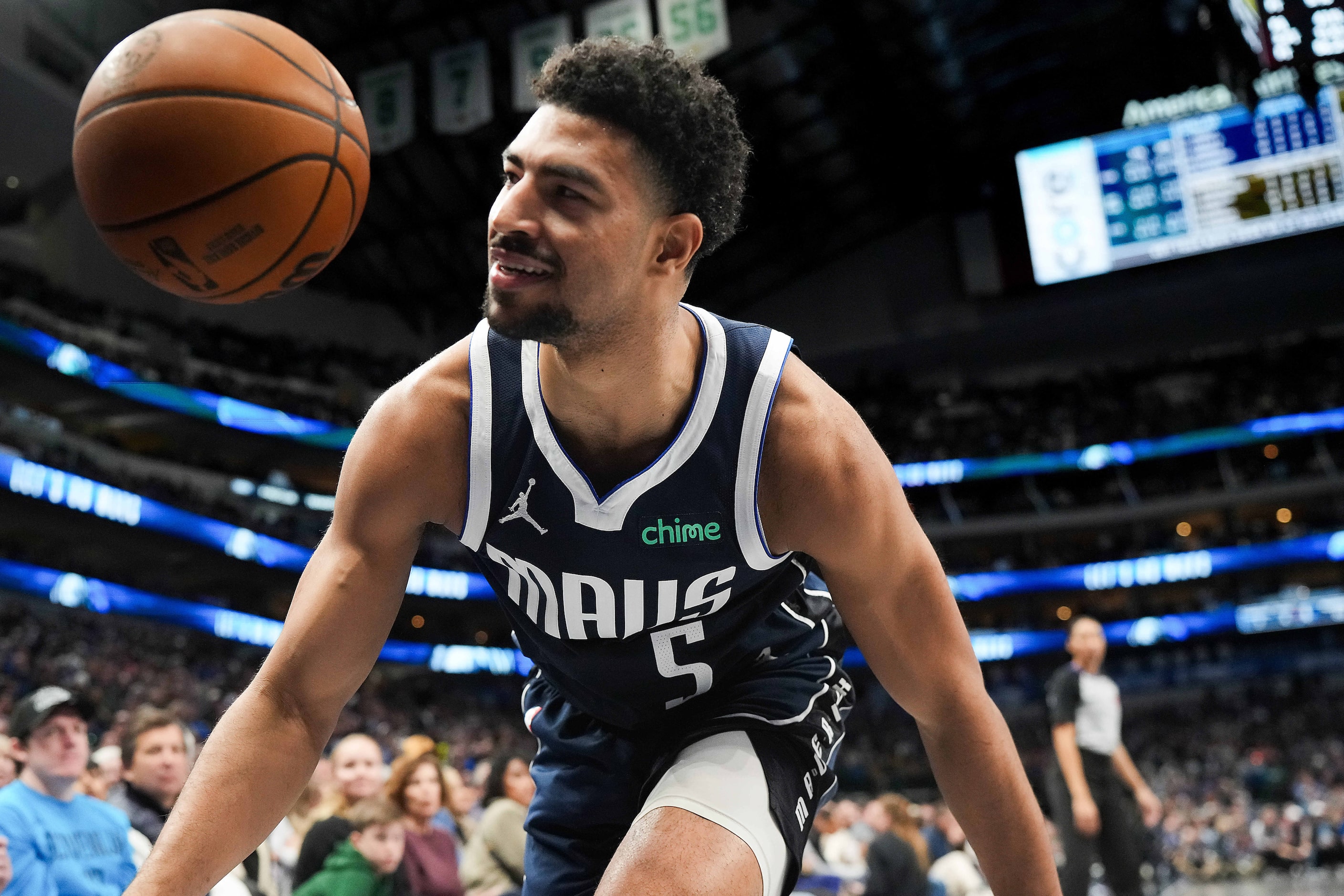 Dallas Mavericks guard Quentin Grimes (5) tried to save the ball from going out of bounds...