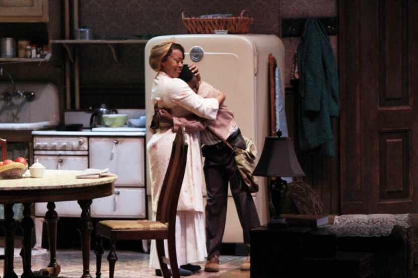 Ruth Younger (Ptosha Storey) hugs her son Travis (Justice Maon) in a scene from "A Raisin in...