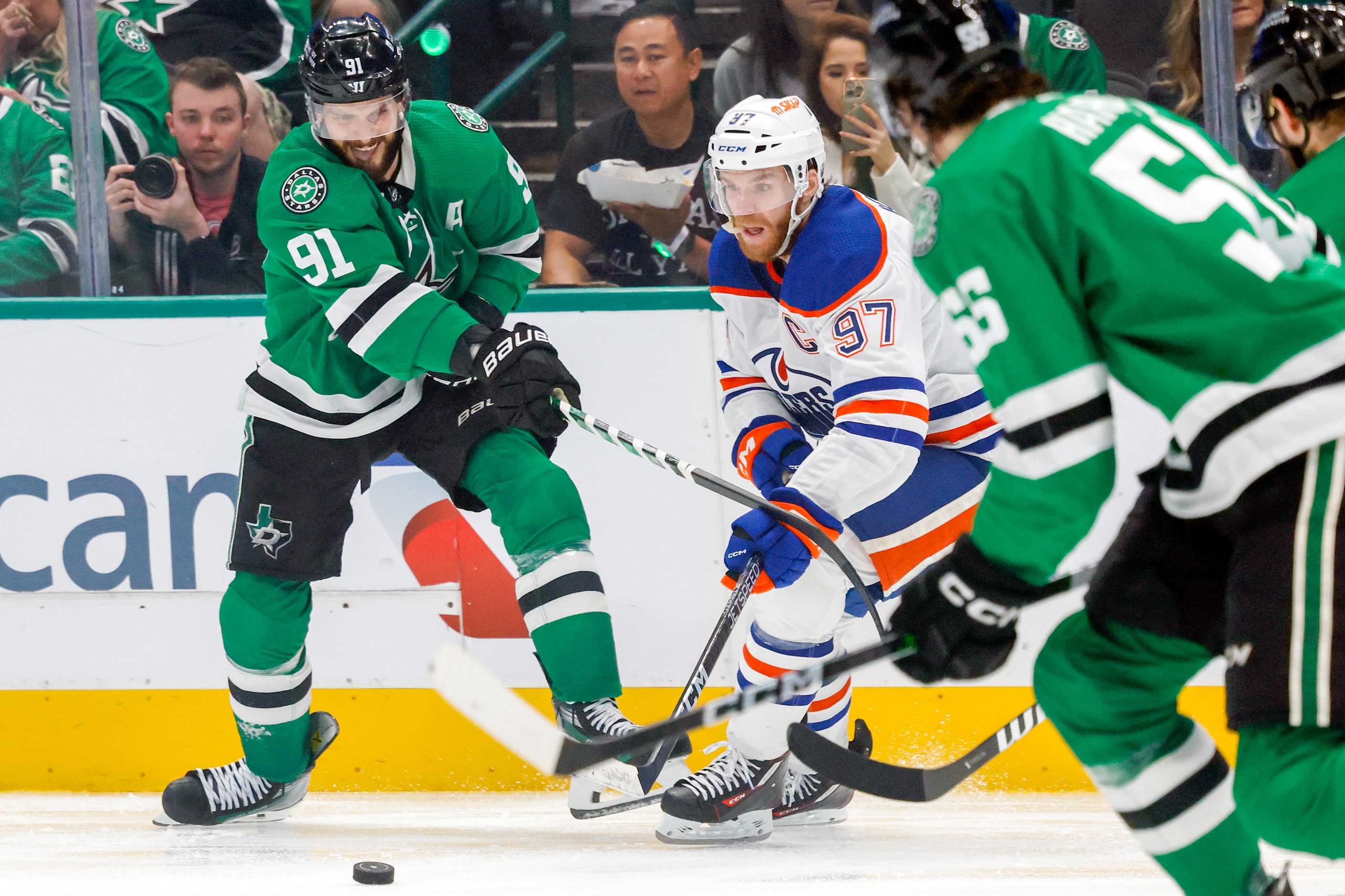 Dallas Stars center Tyler Seguin (91) battles with Edmonton Oilers center Connor McDavid...