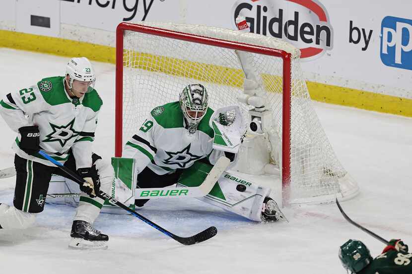 Dallas Stars goaltender Jake Oettinger (29) blocks a shot by Minnesota Wild left wing Marcus...