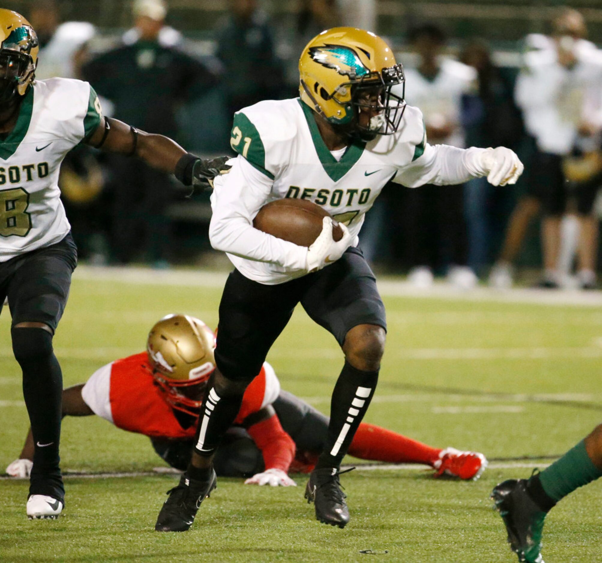 Desoto's Onyei Orupabo (21) runs back and interception against South Grand Prairie during...