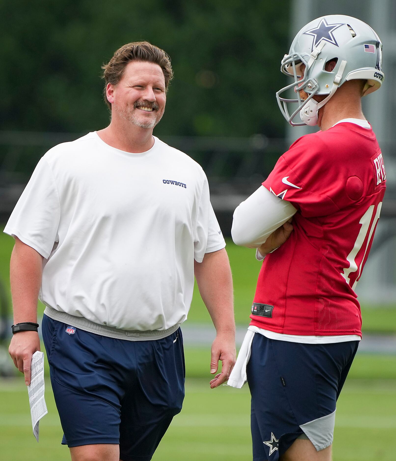 Dallas Cowboys consultant Ben McAdoo talks with quarterback Cooper Rush during a minicamp...