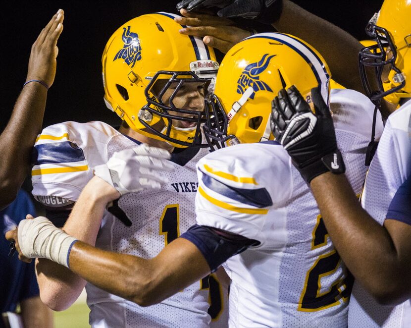 Arlington Lamar High School middle linebacker Reilly Townsend (14) celebrates with team...