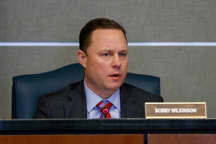 Executive Director Bobby Wilkinson gives a report during a Texas Department of Housing and...