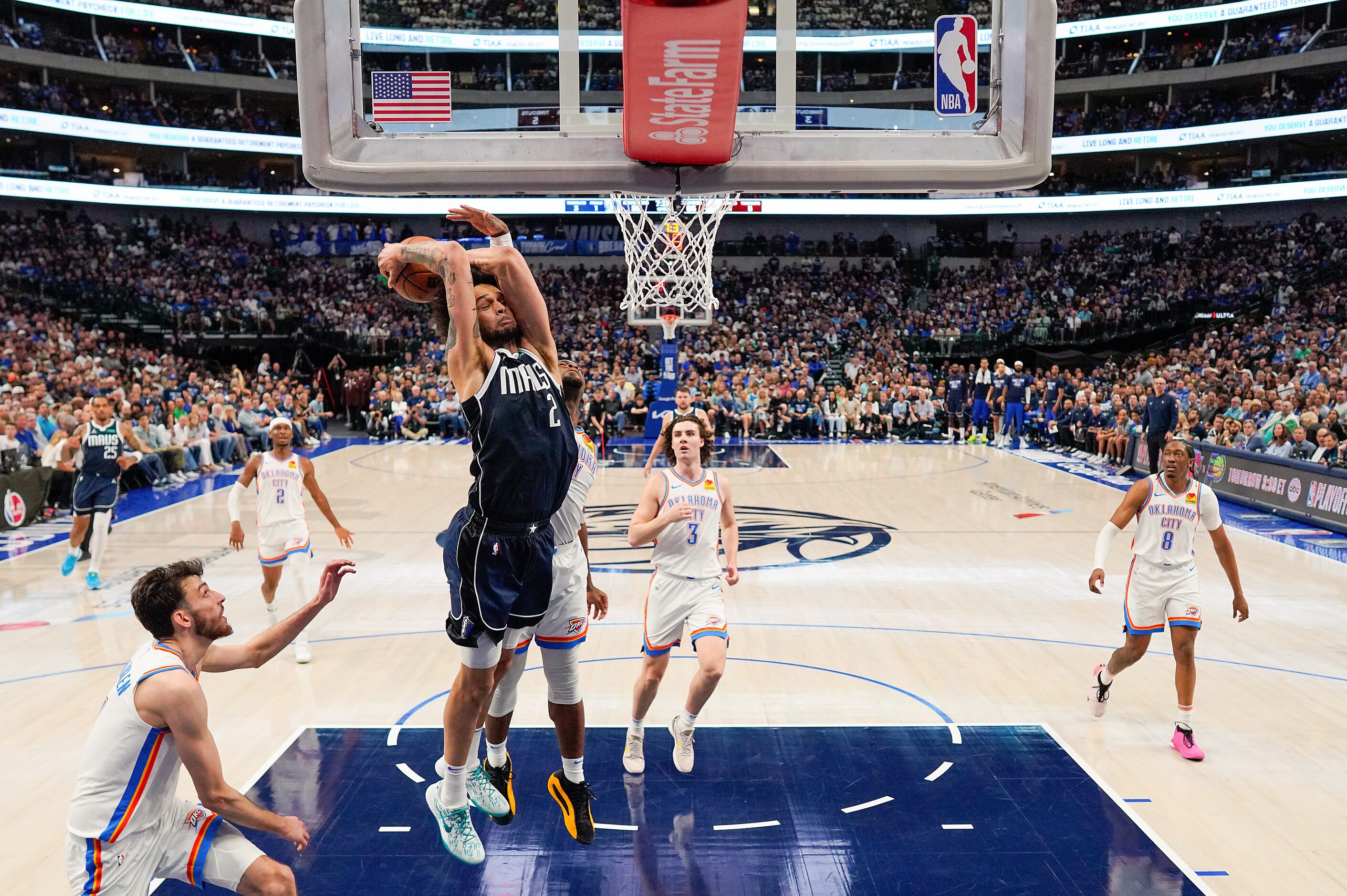 Dallas Mavericks center Dereck Lively II (2) goes up for a dunk past Oklahoma City Thunder...