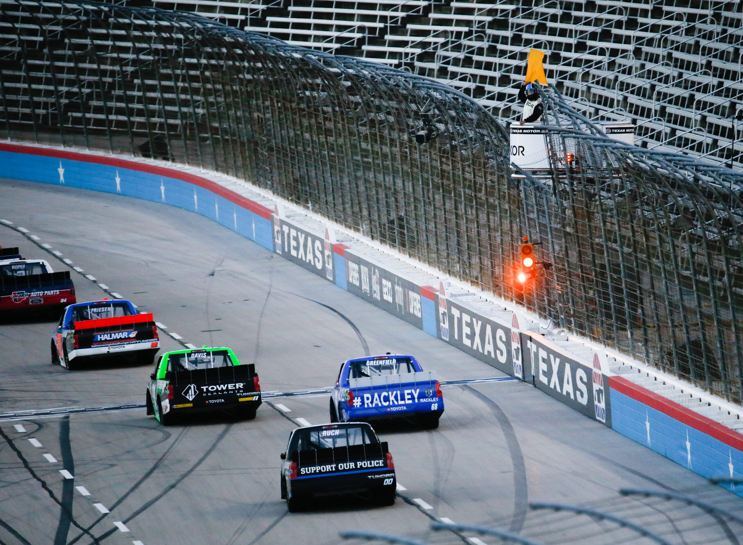 A yellow flag after Jordan Anderson (No. 3) crashes during the NASCAR VANKOR 350 truck...