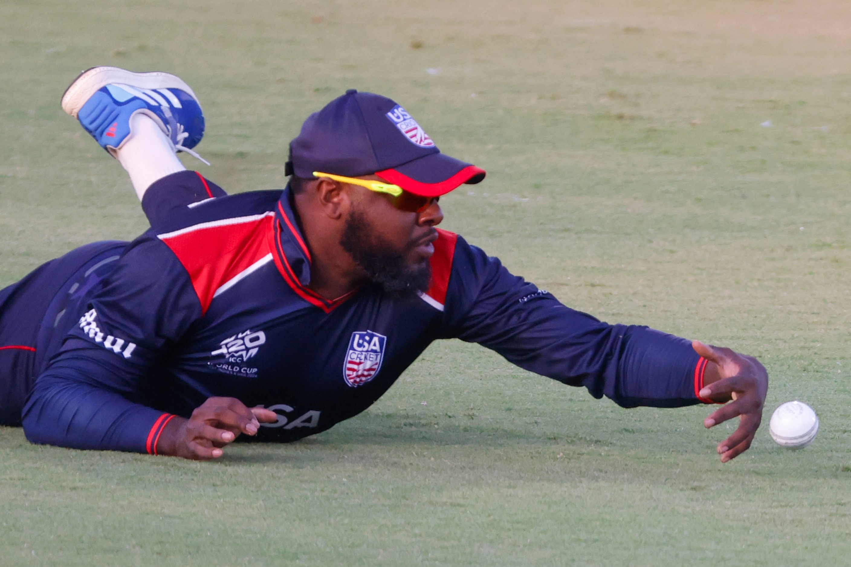 United State’s Steven Taylor  fields a boundary during the men's T20 World Cup cricket match...