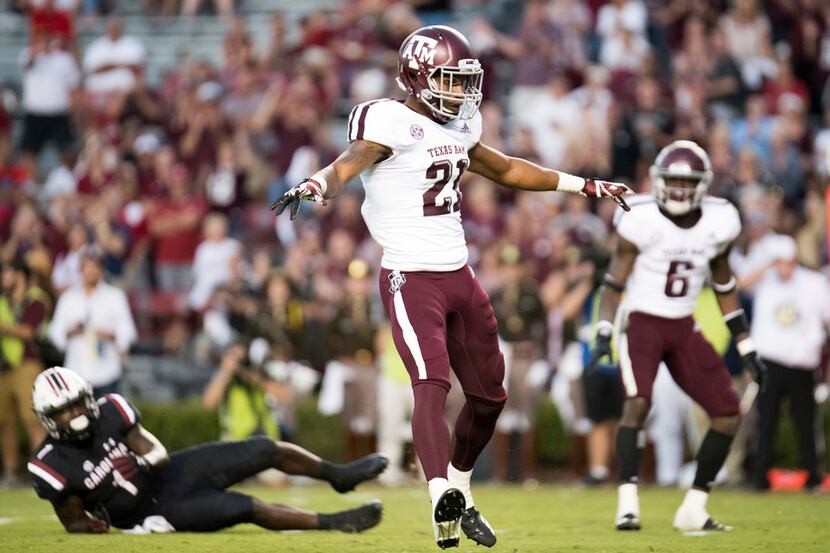 Texas A&M defensive back Charles Oliver (21) reacts after a play during the second half of...