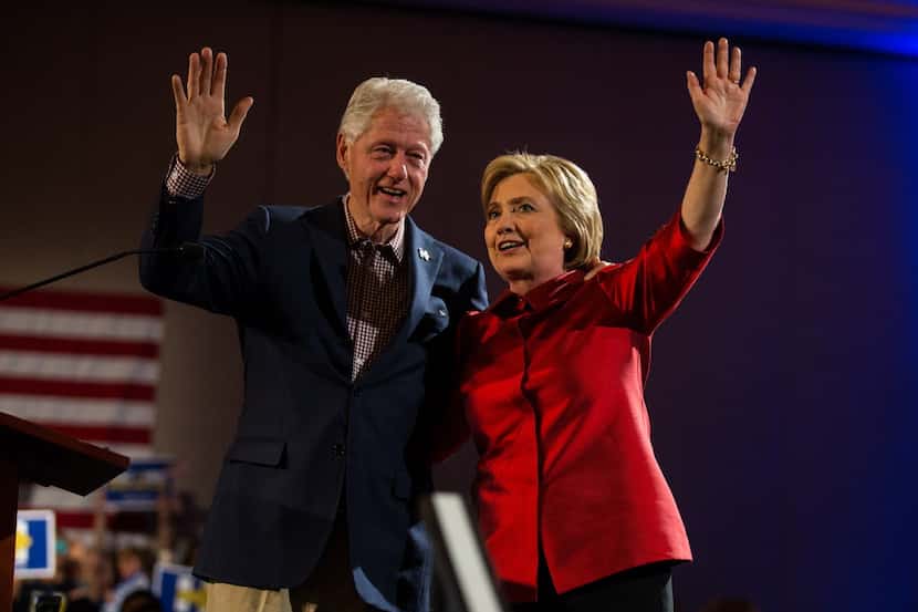  Hillary and Bill Clinton wave to supporters in Las Vegas on Saturday night, Feb. 20, 2016.