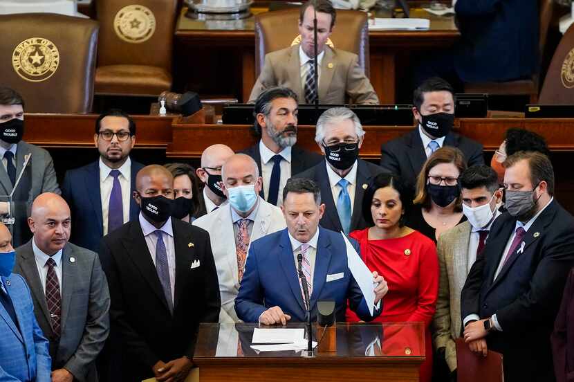 Democrats gather around Rep. Rafael Anchía, D-Dallas, as he speaks in opposition to SB-7 on...