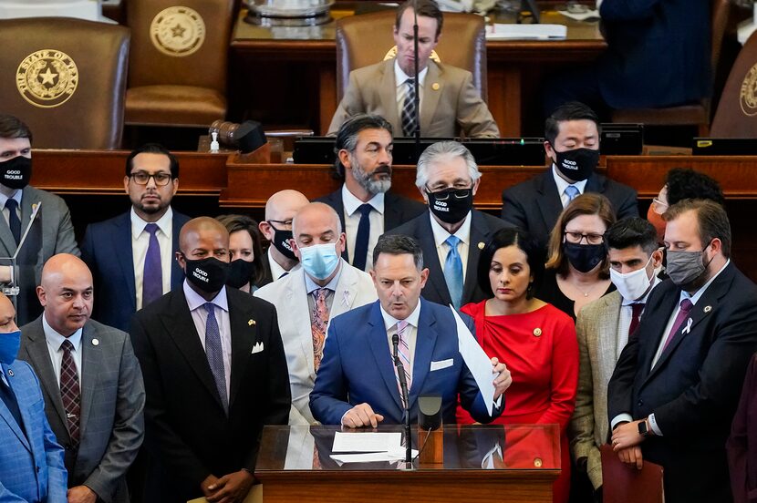 Democrats gather around Rep. Rafael Anchía, D-Dallas, as he speaks in opposition to SB-7 on...