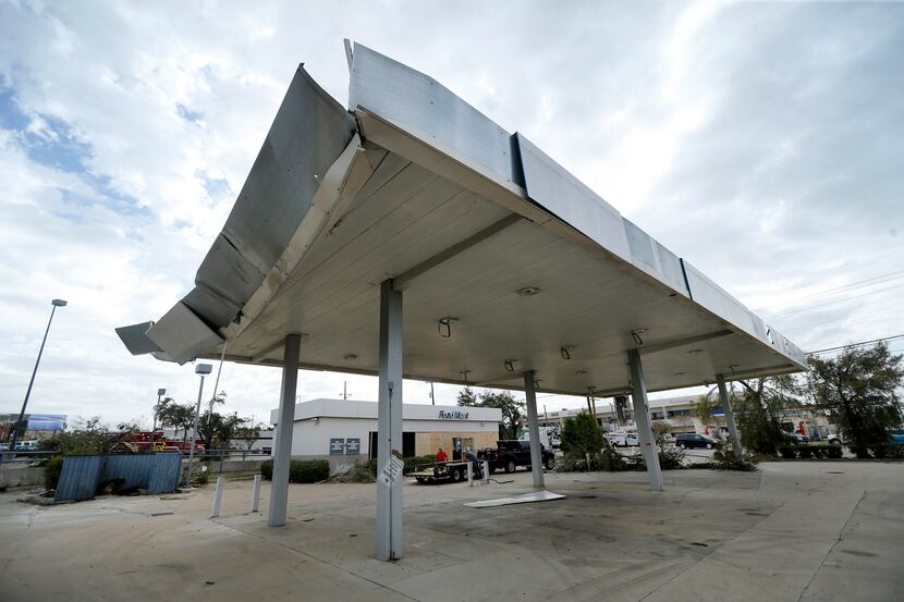 This abandoned gas station, long a source of code violations, sustained damage from the...
