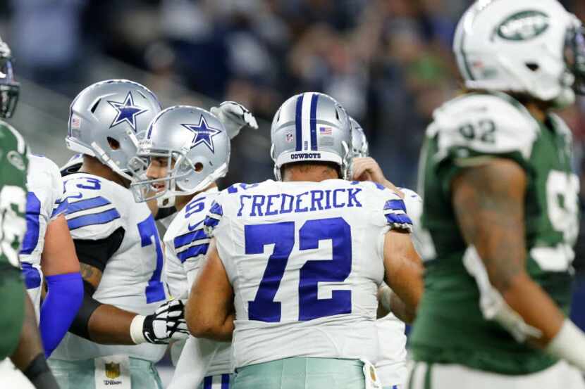 Dallas Cowboys kicker Dan Bailey (5) is congratulated by teammates after tying the game with...
