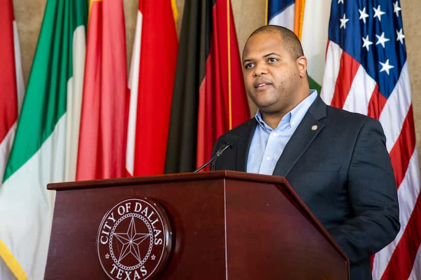Mayor Eric Johnson announces action passed by the city council to help residents and...