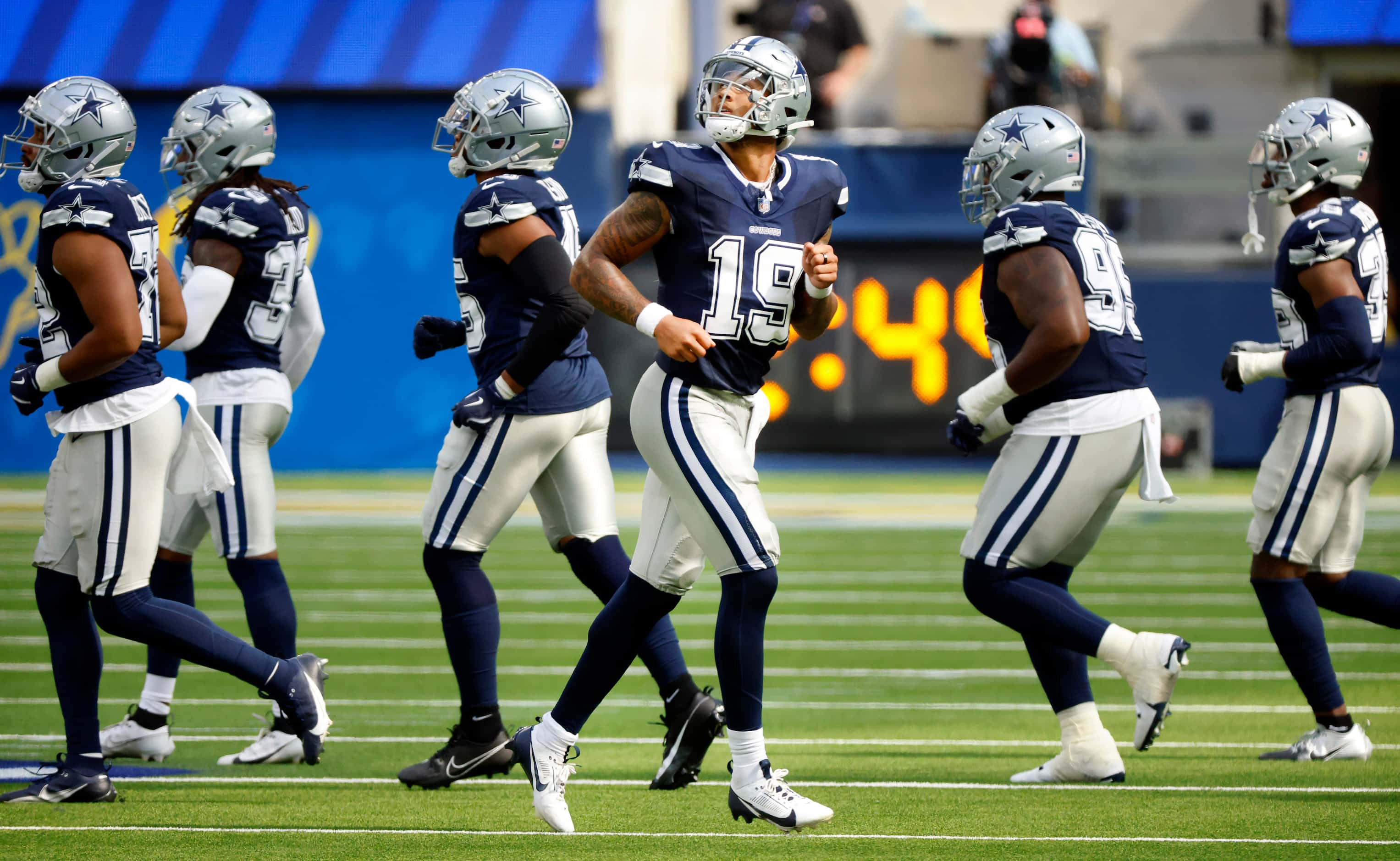 Dallas Cowboys quarterback Trey Lance (19) looks to the video replay after a fourth down...