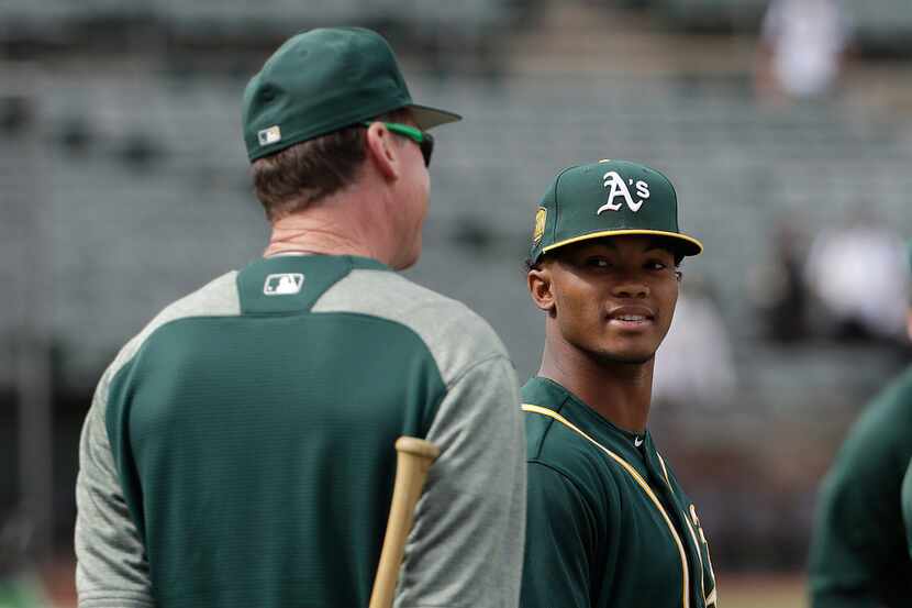  Kyler Murray (right) talks with manager Bob Melvin during batting practice before a...