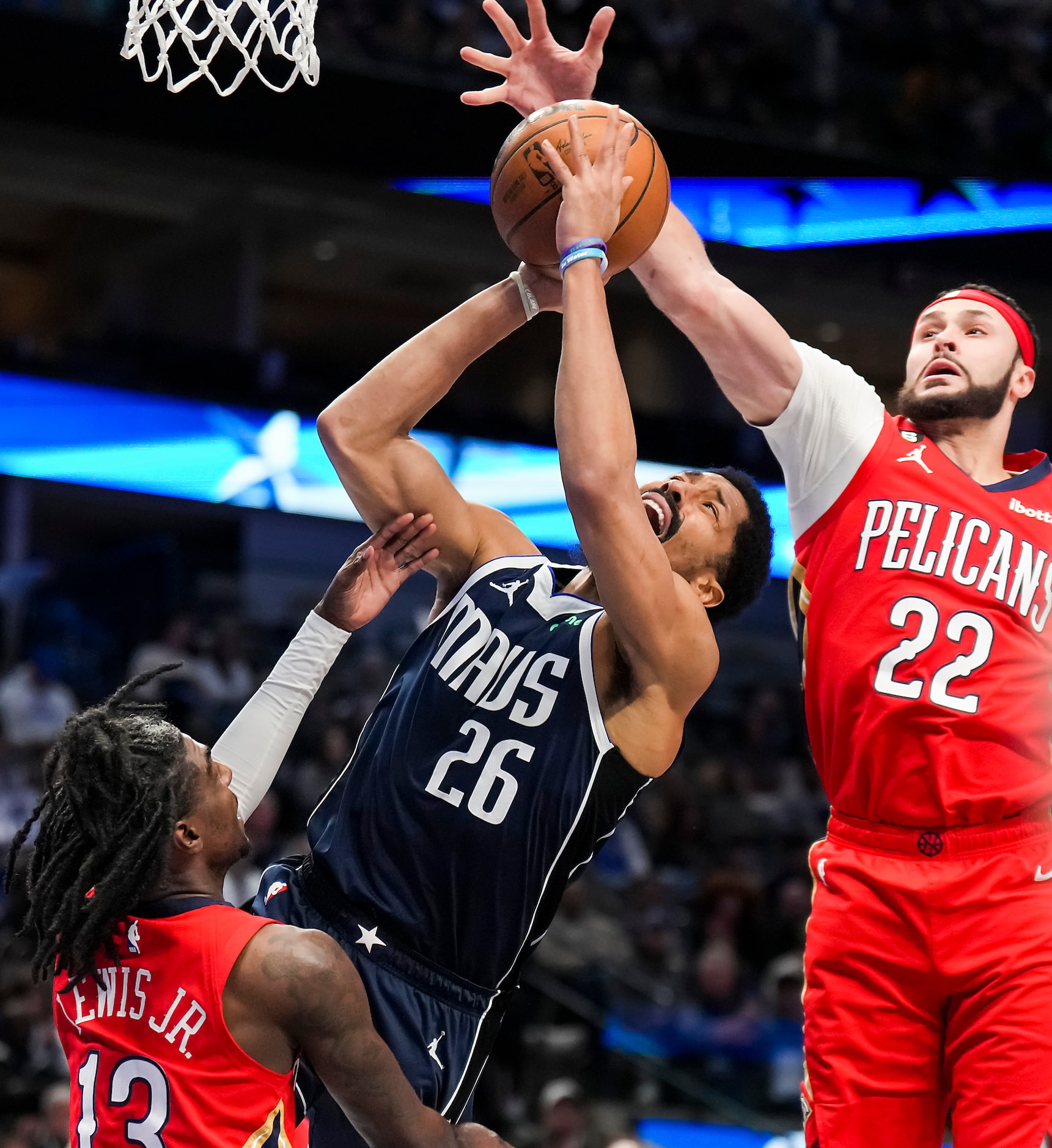 Dallas Mavericks guard Spencer Dinwiddie (26) is fouled as he drives to the hoop between New...