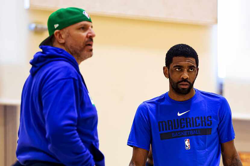 Dallas Mavericks guard Kyrie Irving (right) looks on with head coach Jason Kidd during a...