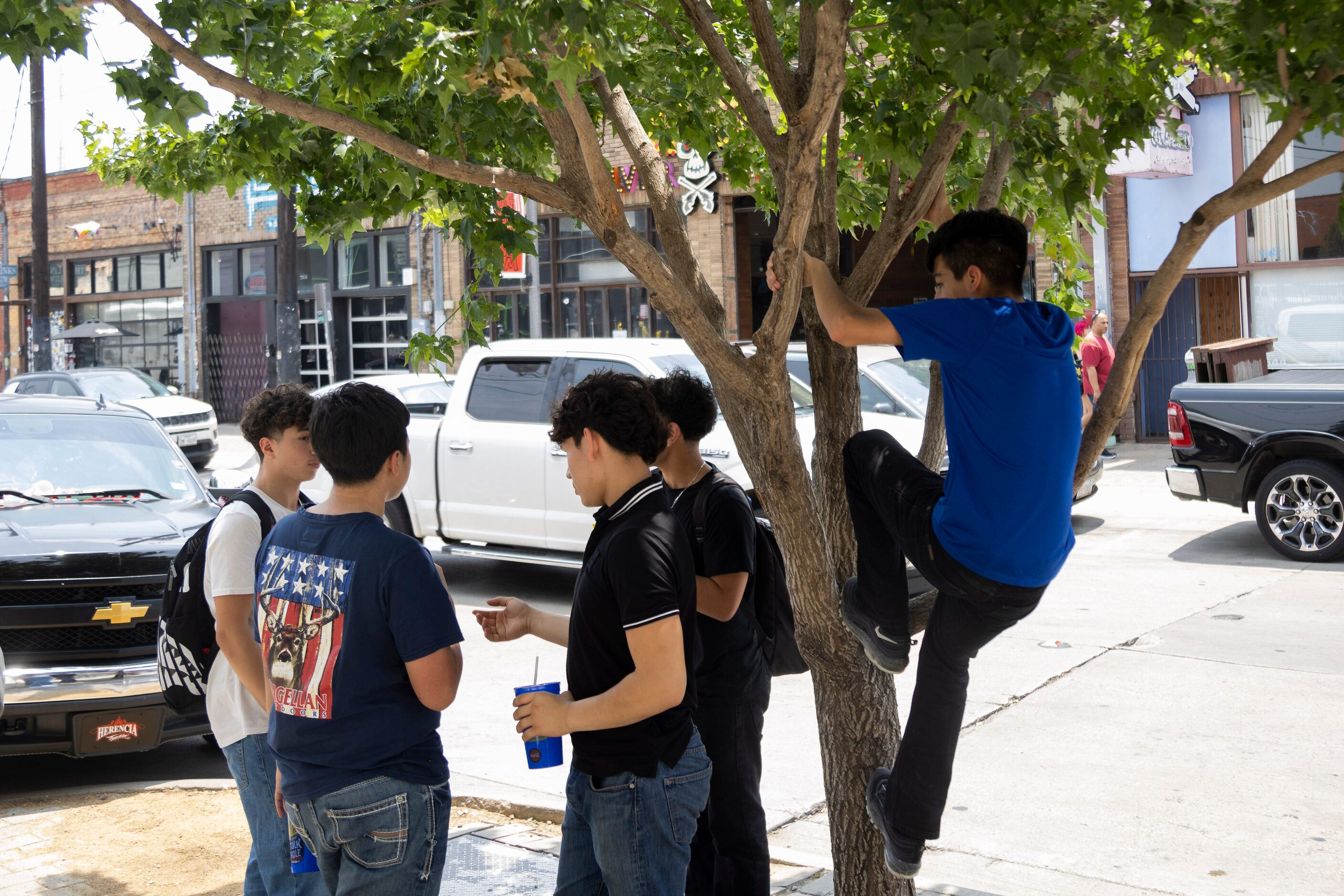 Students from Uplift Luna Preparatory School hang out in the Deep Ellum district of Dallas...