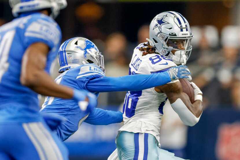 Detroit Lions cornerback AJ Parker (41) tackles Dallas Cowboys wide receiver CeeDee Lamb...