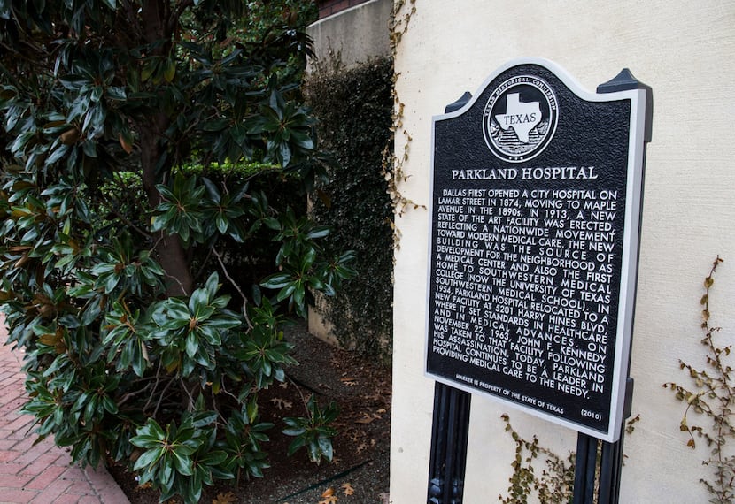 A historic marker is posted outside the original hospital building at Old Parkland on...