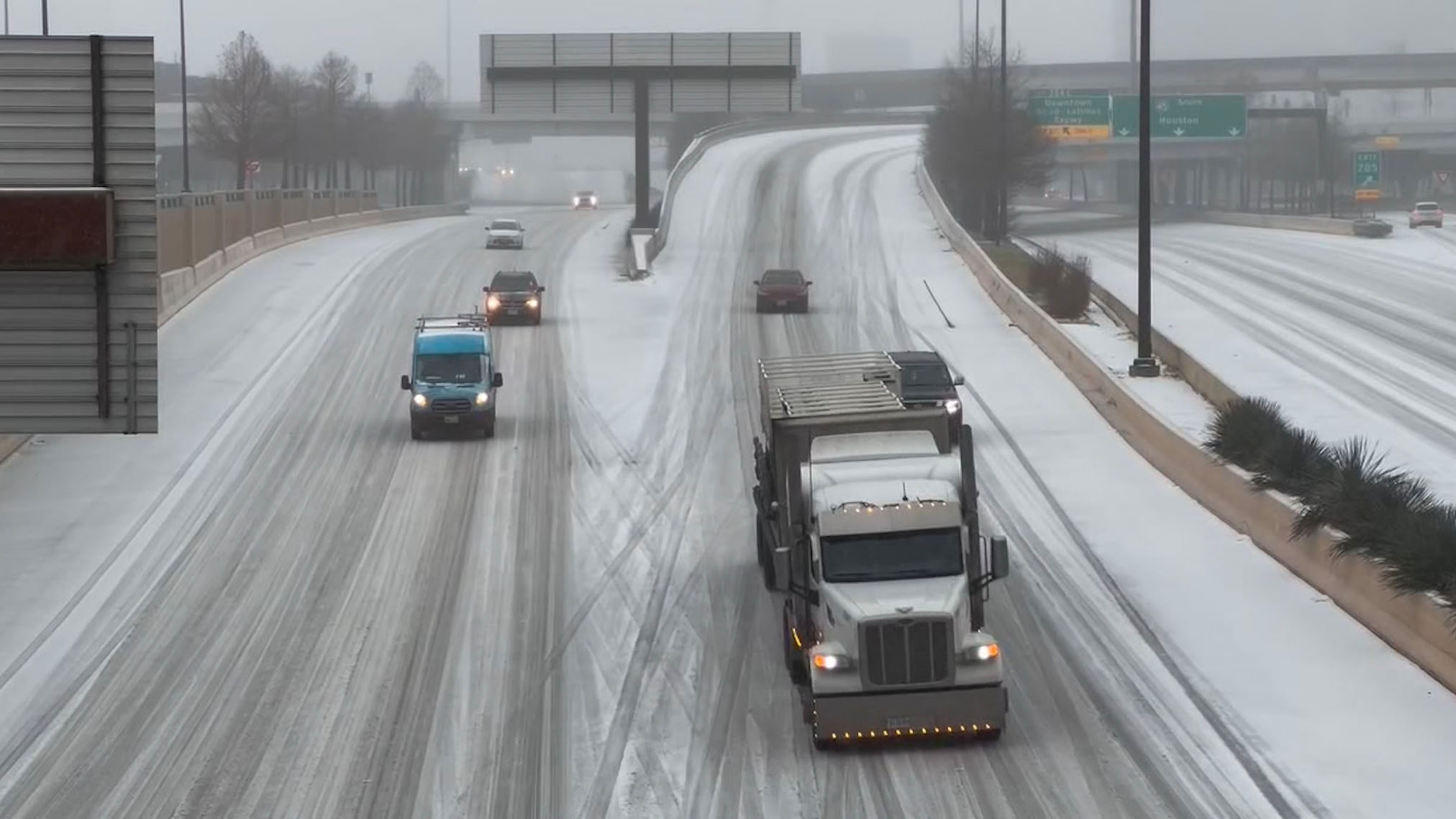 Traffic flows along an icy U.S. Highway 75 in Dallas during a winter storm on Tuesday, Jan....