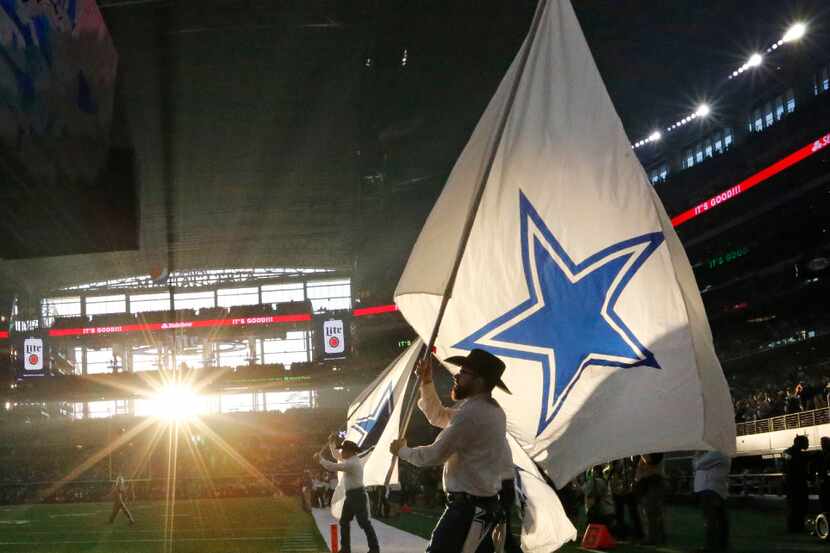 The afternoon sun highlights the Cowboys flags during the Washington Redskins vs. the Dallas...
