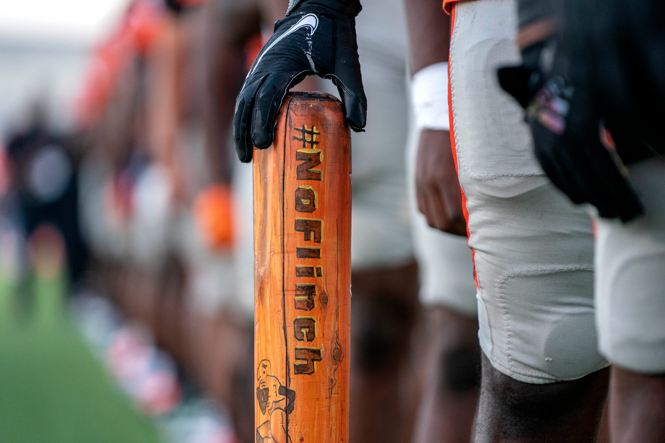 Lancaster senior offensive lineman Duvail Chatmon (52) holds a wooden bat that reads...