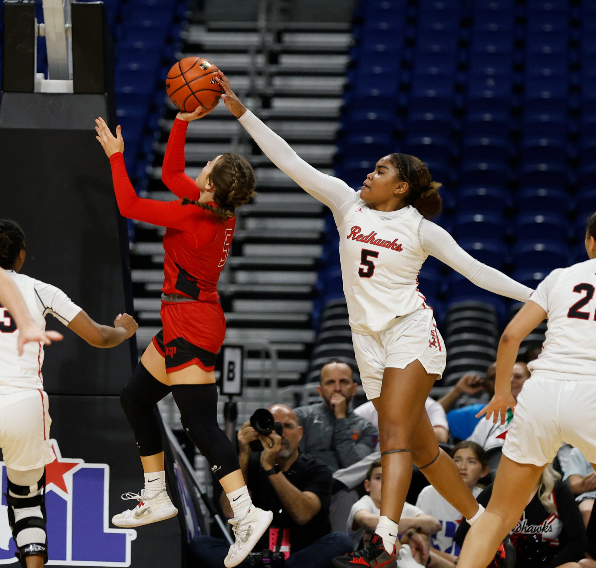 Frisco Liberty Keyera Roseby (5) blocks shot of Lubbock Cooper Peyton North (5) in girls...