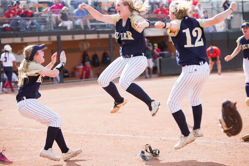 Keller senior pitcher Kaylee Rogers, center, celebrates after the final out during a game...