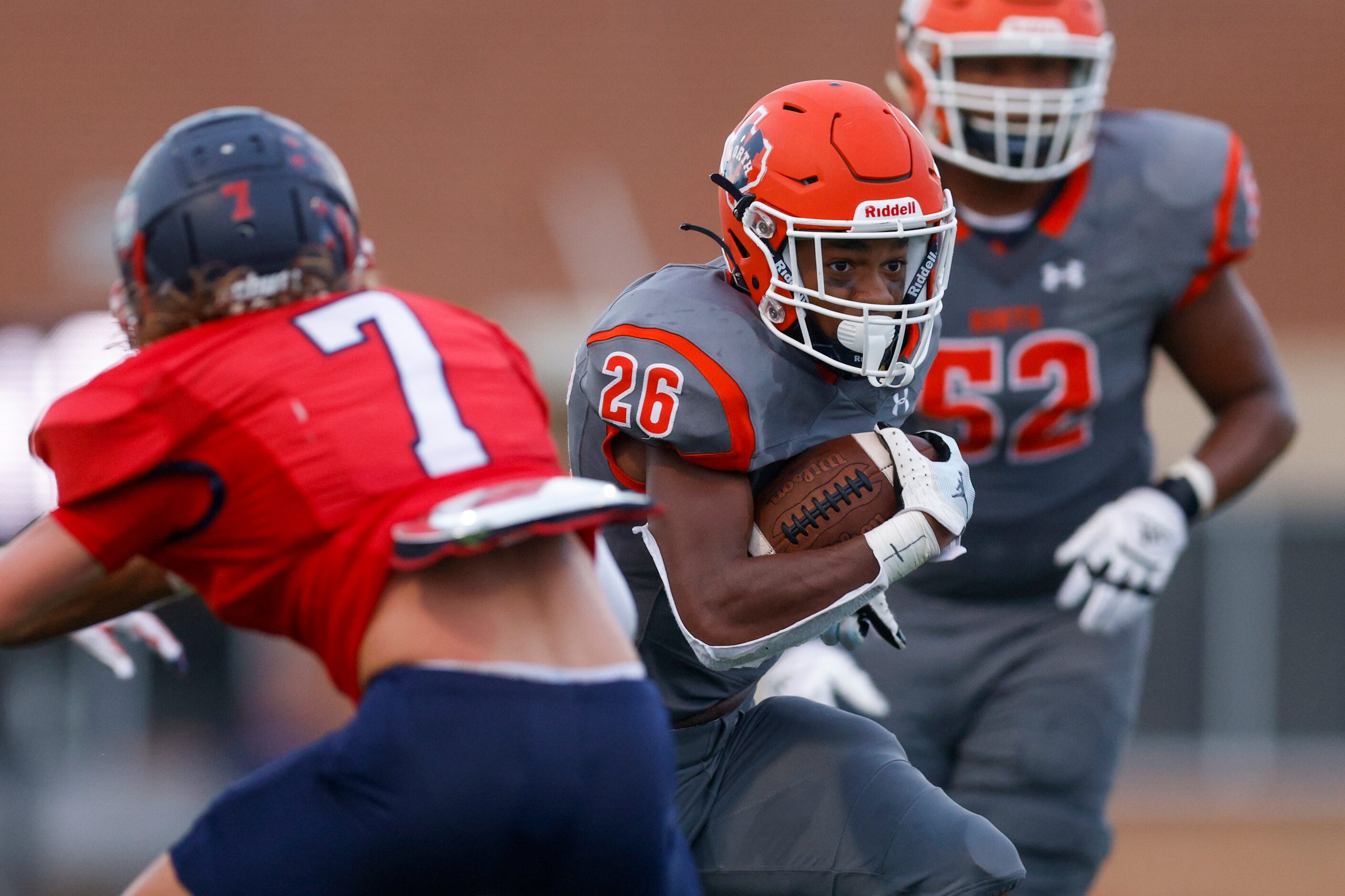 McKinney North running back Jayden Walker (26) runs past Justin Northwest defensive back...