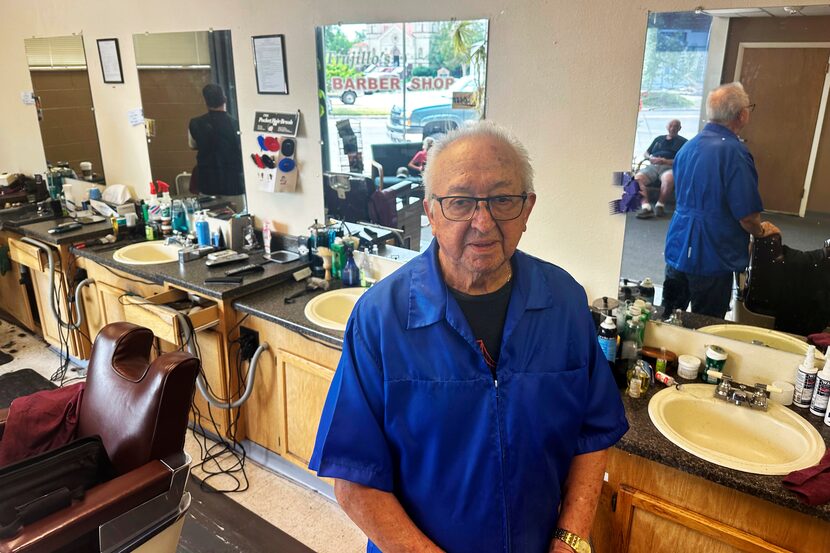 Eli Trujillo poses inside his barbershop in Cheyenne, Wyo., Thursday, July 18, 2024....