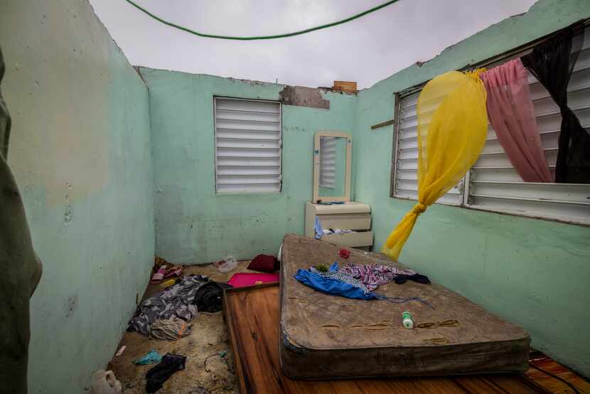 Nelson Cirino's home stands with its roof torn off by the winds of Hurricane Fiona in Loiza,...