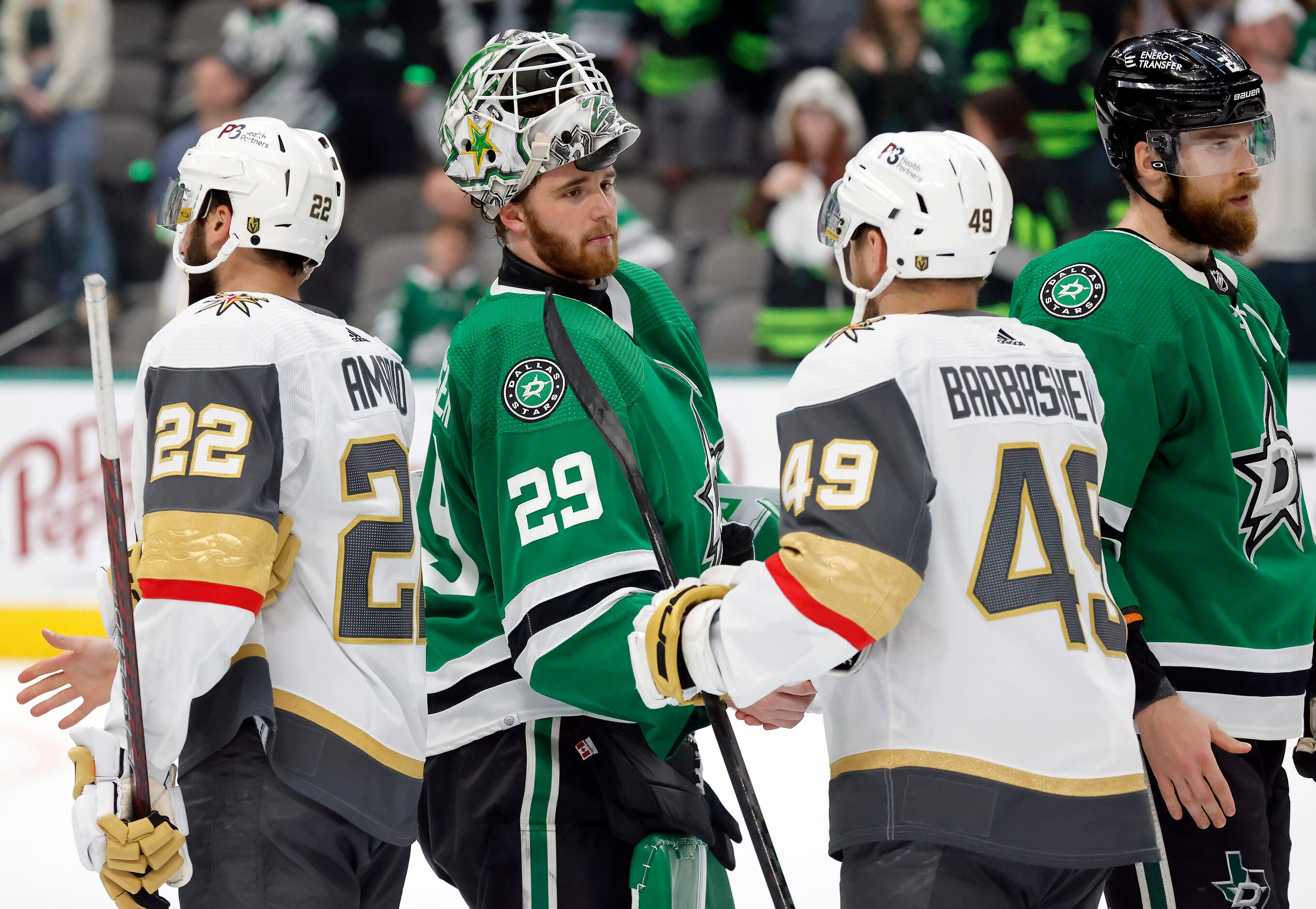 Dallas Stars goaltender Jake Oettinger (29) shakes hands with Vegas Golden Knights center...