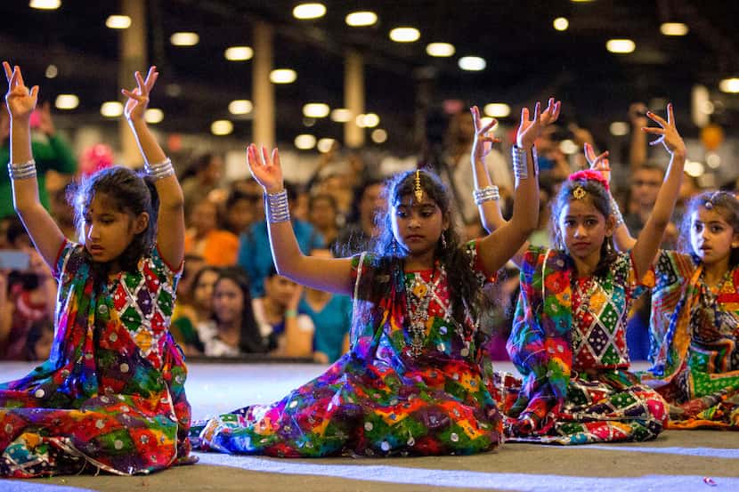Children in dance teams perform onstage during Diwali Mela at Fair Park in 2016. This year's...