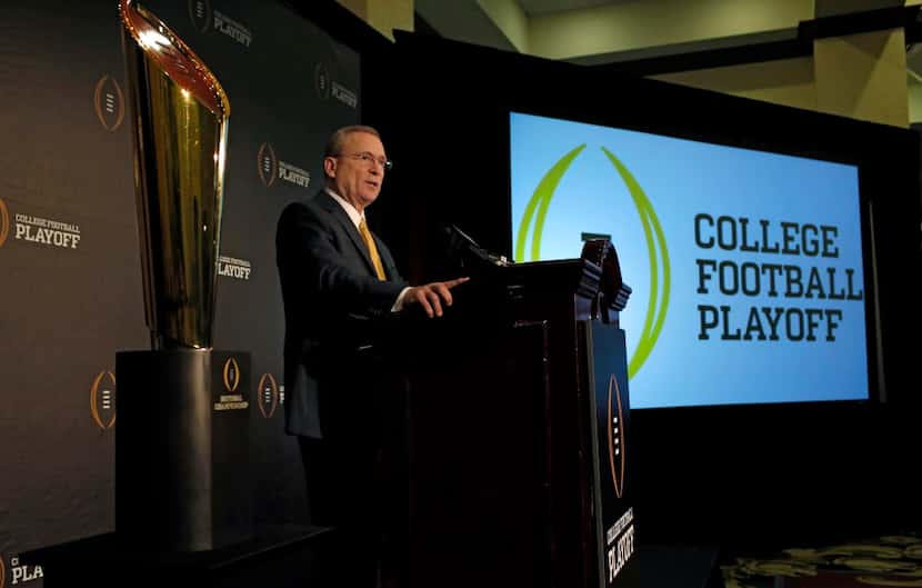 The College Football Playoff committee chairman  Jeff Long talks to reporters about the...