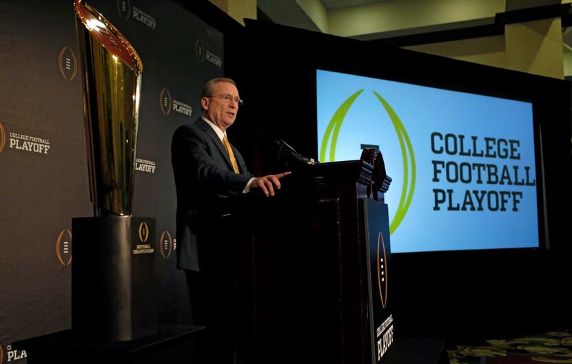 The College Football Playoff committee chairman  Jeff Long talks to reporters about the...